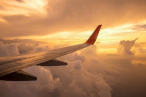 aircraft-wing-clouds-sunset